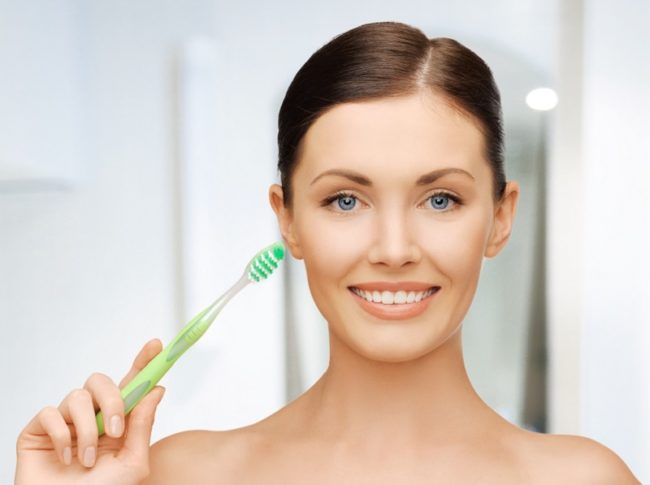 woman with toothbrush