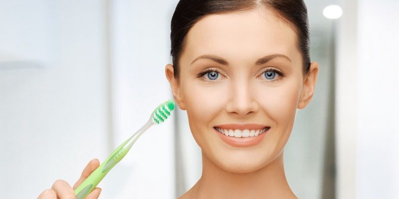 woman with toothbrush